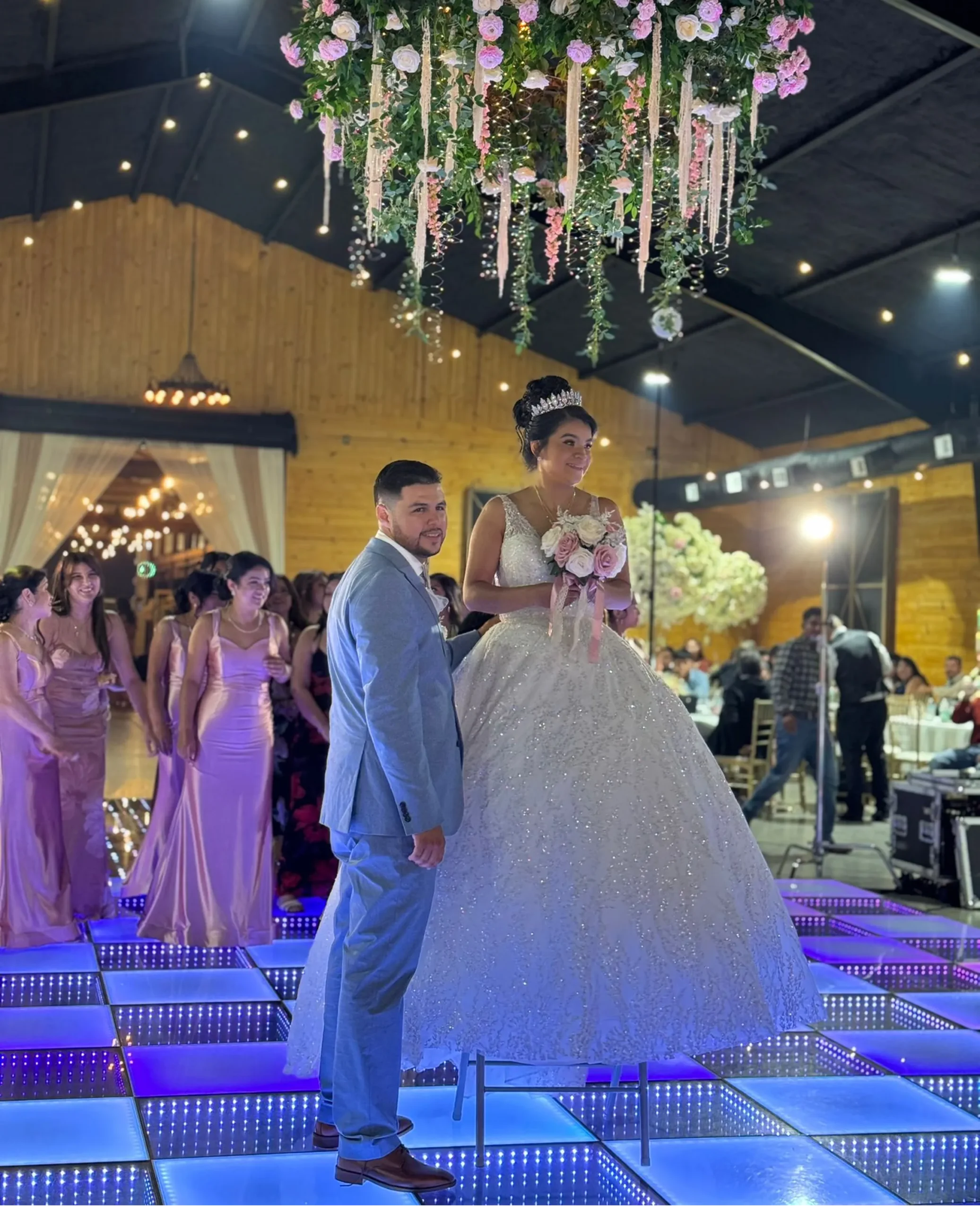 Front Row FX event production Minneapolis with LED dance floor, LED screens, lighting, sound, DJ and LED robot shows for weddings, quinceaneras, corporate and cultural events in Minnesota. pista de baile iluminada en minnesota y wisconsin
